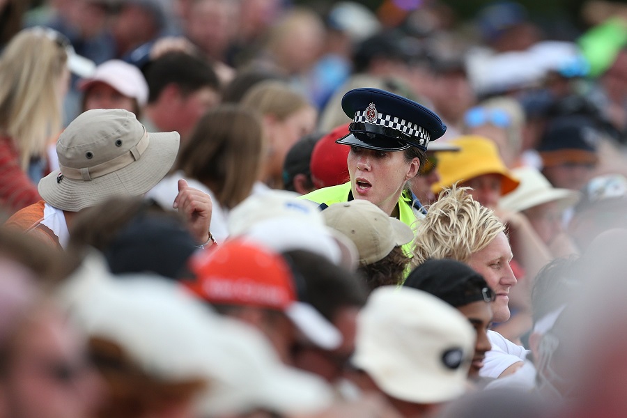 A police officer tries to calm supporters during the match. Photo: Getty Images