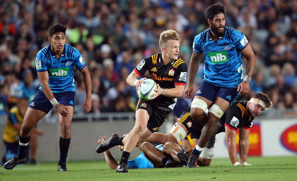 Damian McKenzie makes a run for the Chiefs against the Blues. Photo: Getty 