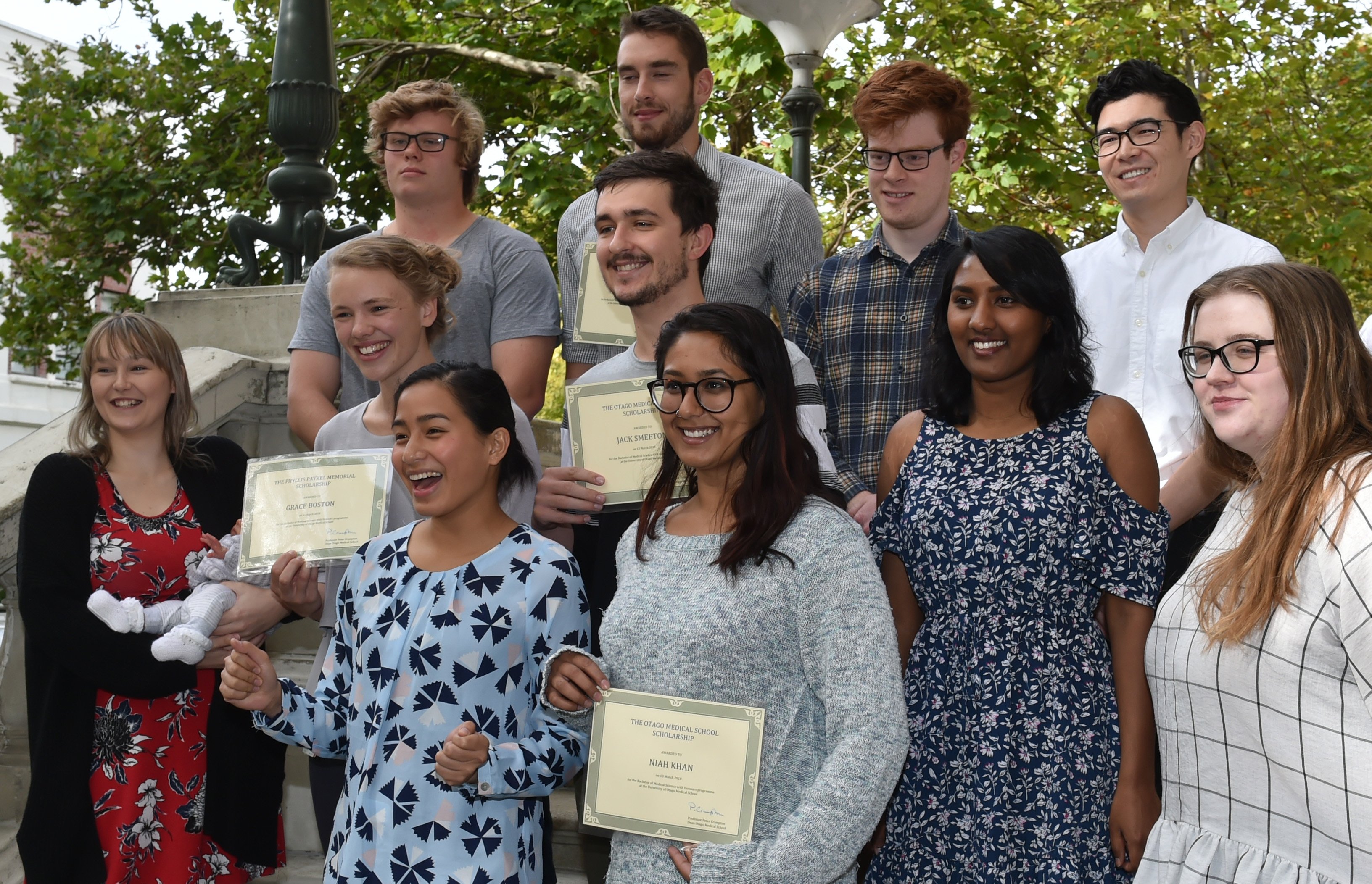 University of Otago bachelor of medical science honours award recipients are (from left, front) Mary Cane Demecillo, Niah Khan, (second row ) Bryony Harrison and her son Aurelius Yates, Grace Boston, Jack Smeeton, Danushi Peiris, Laura Bolger, (back row)