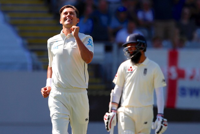 England's Moeen Ali reacts as Trent Boult celebrates after bowling England's Chris Woakes during the first day of the first cricket test match. Photo: Reuters