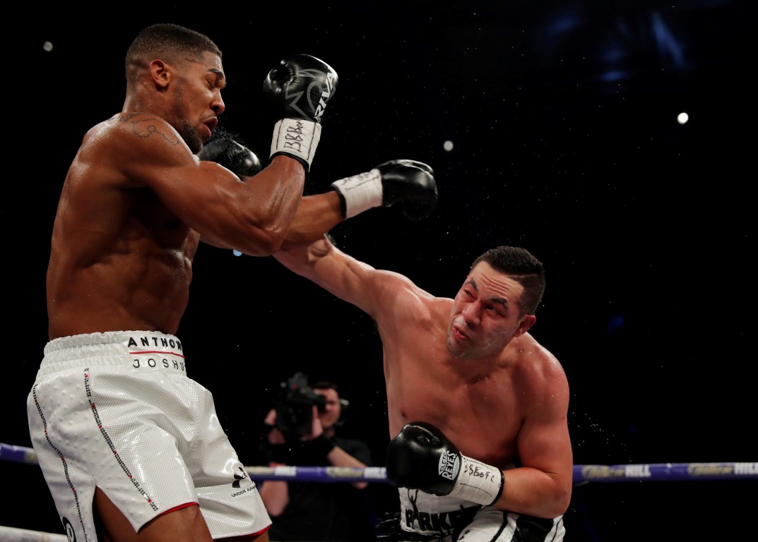 Joseph Parker (R) lands a punch on Anthony Joshua during their bout in Cardiff. Photo: Reuters
