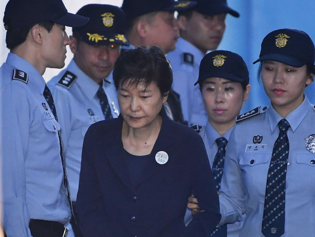 Park Geun-hye arrives for a court appearance at the Seoul Central District Court in May last year...