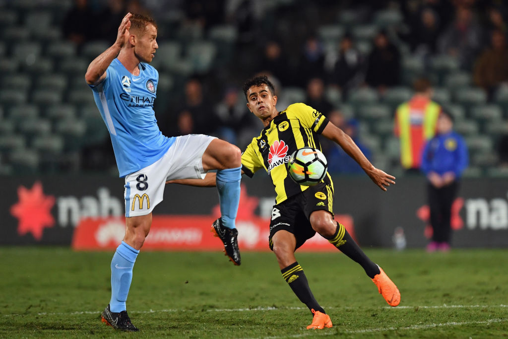 The Phoenix' Sarpreet Singh (R) contests the ball with Melbourne's Oliver Bozanic. Photo Getty...