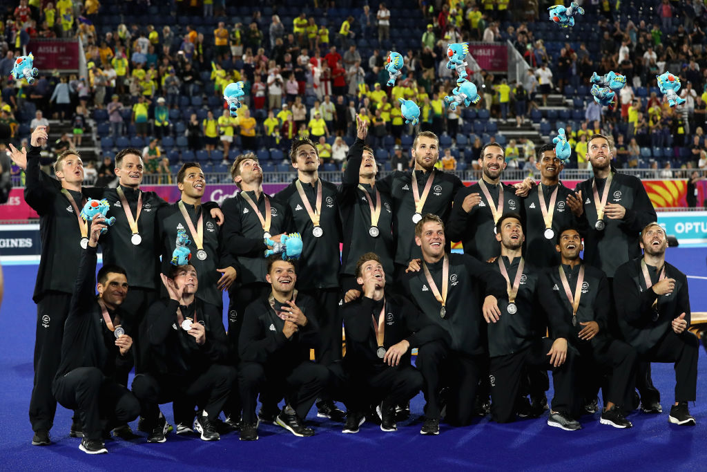 The New Zealand men's hockey team celebrate with their silver medals after the match. Photo: Getty