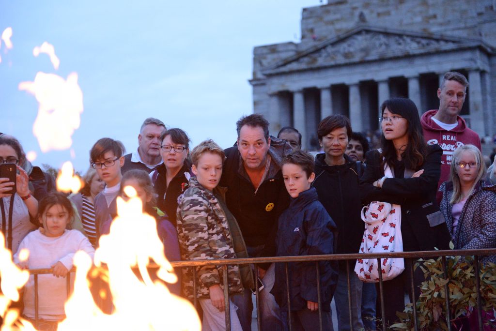 People gather at Melbourne's Shrine of Remembrance to pay their respects during the city's Anzac...