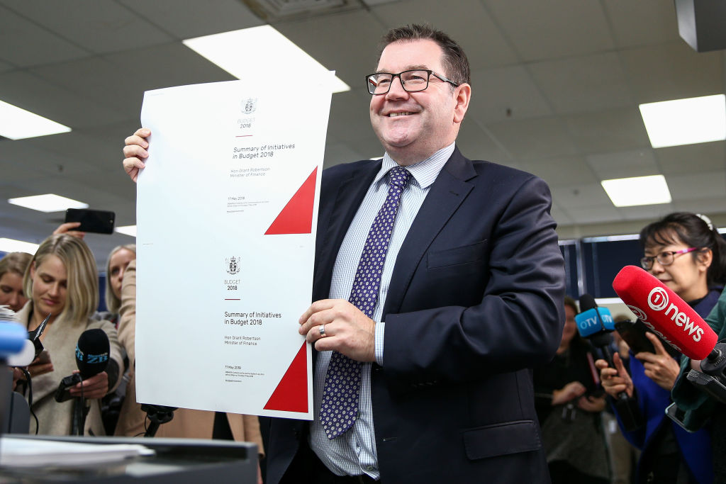 Finance Minister Grant Robertson holds a copy of the 2018 Budget cover at Printlink in Wellington...