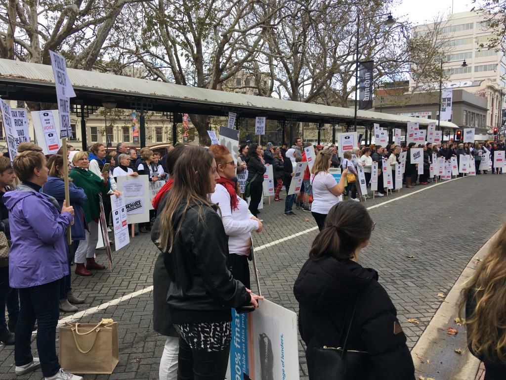 People take part in the Hear Our Voices rally in the Octagon in Dunedin. Photo: Jono Edwards