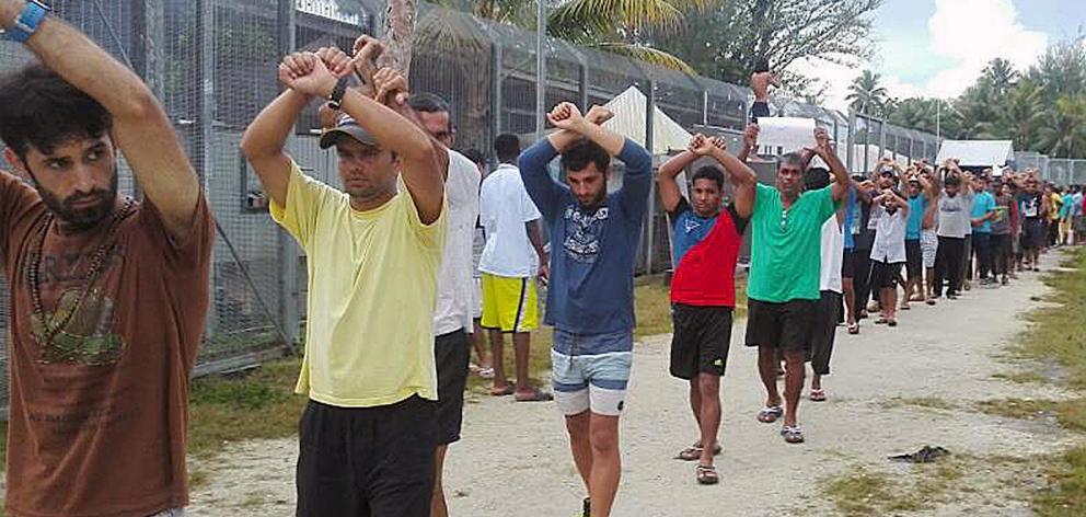 Detainees stage a protest inside the compound at the Manus Island detention centre. Photo:...