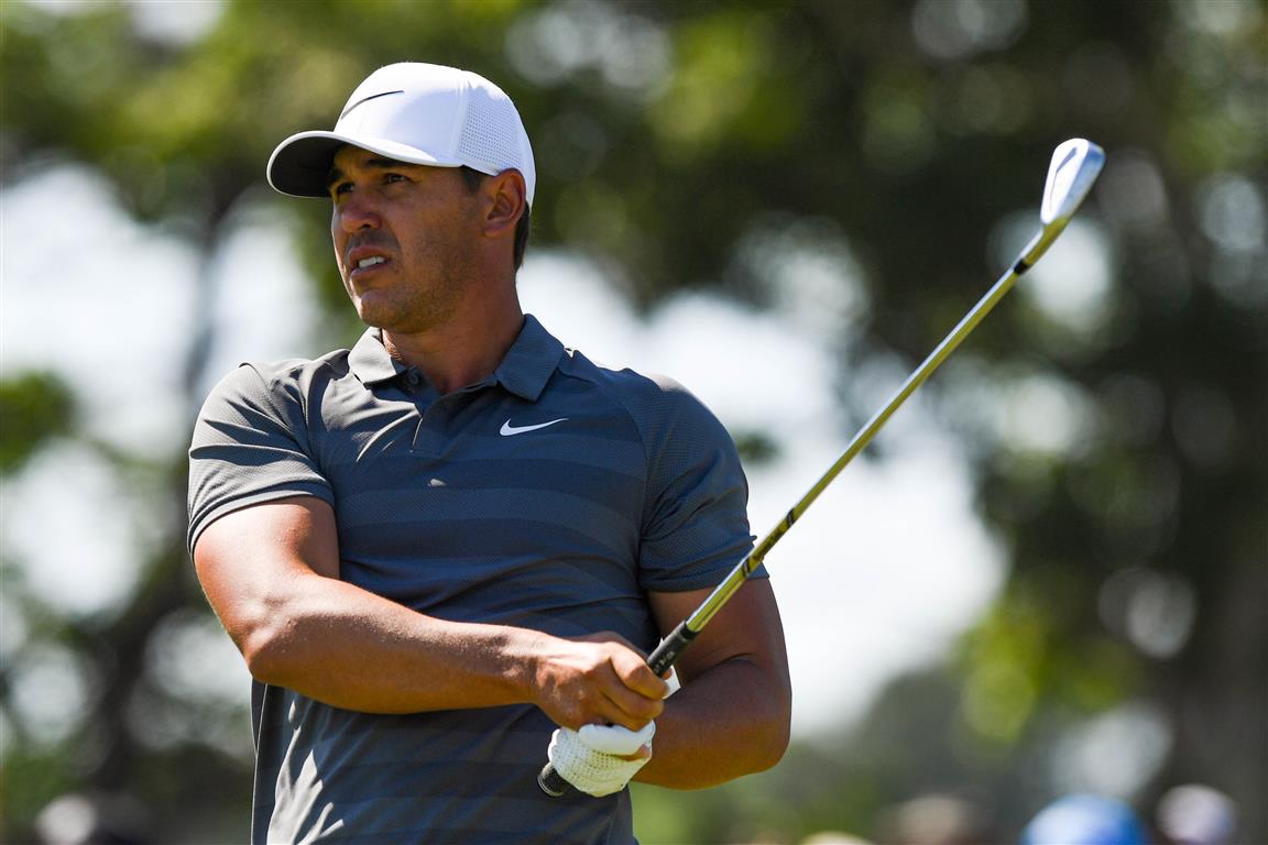 Brooks Koepka tees off the seventh hole during the final round of the US Open at Shinnecock Hills...