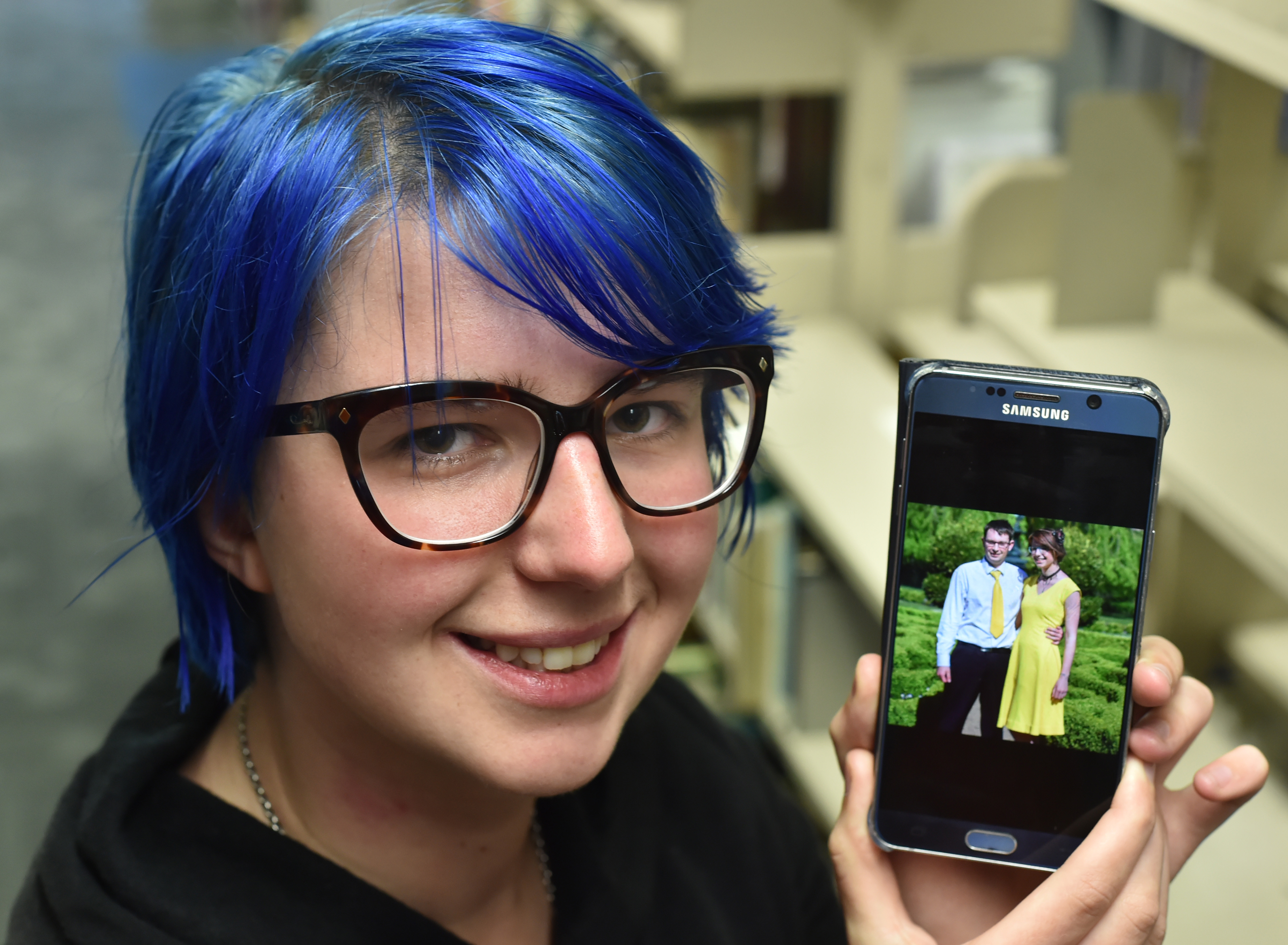 Seeking closure ... Amy McCarthy (24) with a picture of her boyfriend, who was killed in an...