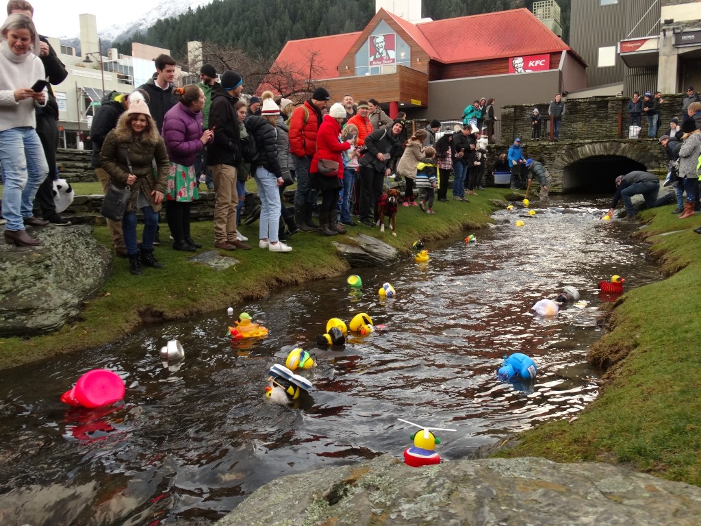 A big crowd gathered on the Village Green to watch hundreds of decorated ducks float down Horne...