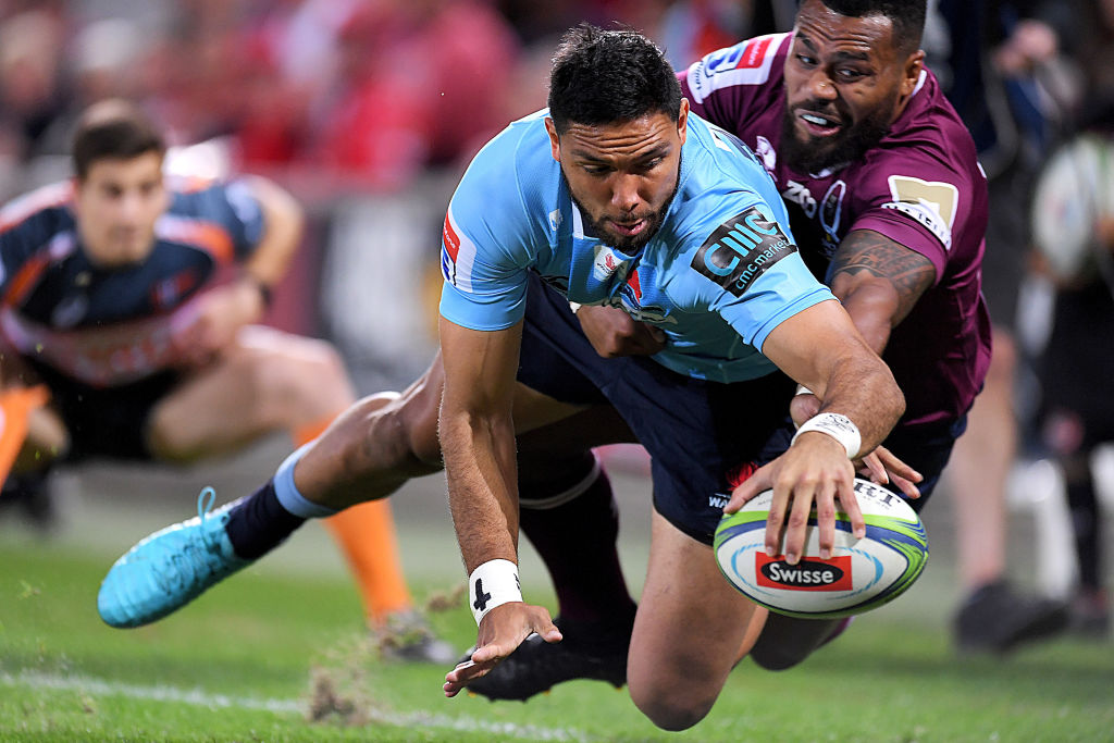 Curtis Rona dives over to score for the Waratahs against the Reds. Photo: Getty Images
