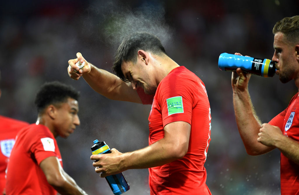 England's Harry Maguire sprays himself with insect repellant. Photo: FIFA via Getty Images 