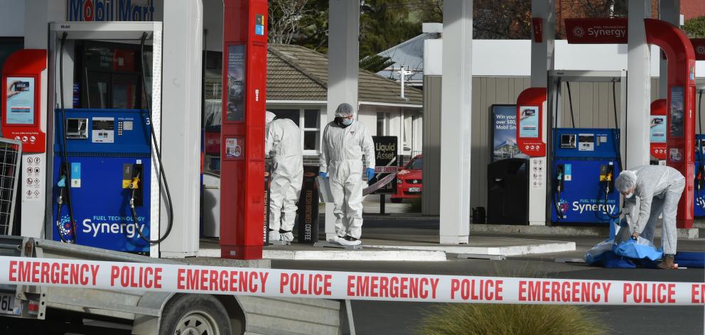 Police conducted a scene examination at Mobil Forbury following the alleged assault. Photo:...