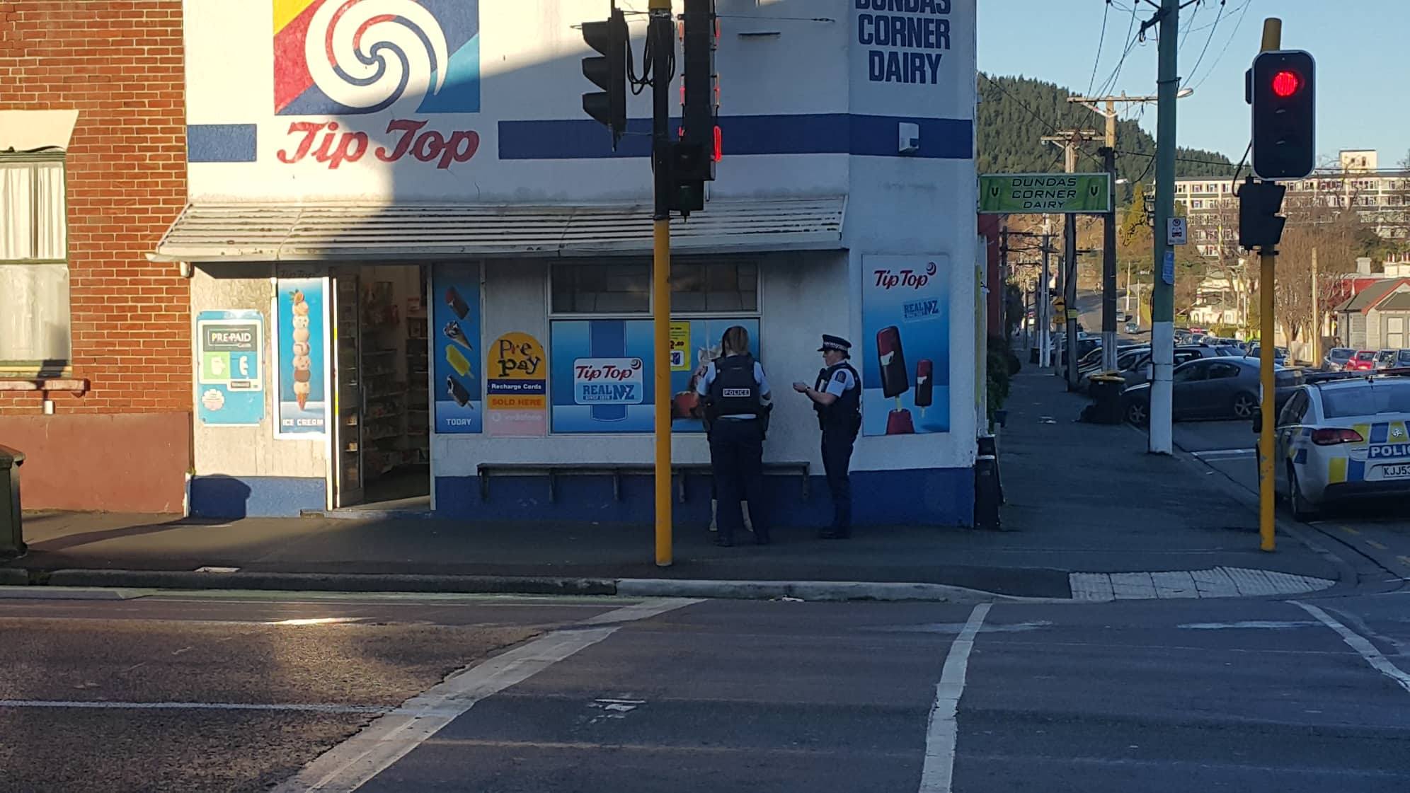Police outside Dundas Corner Dairy following a suspected robbery. Photo: George Block