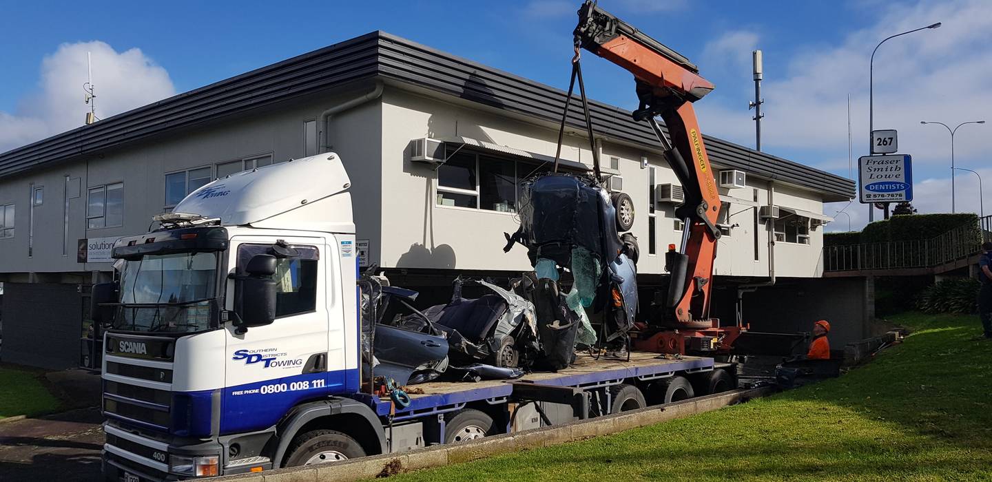 The shattered wreckage is removed from the crash scene. Photo: NZME