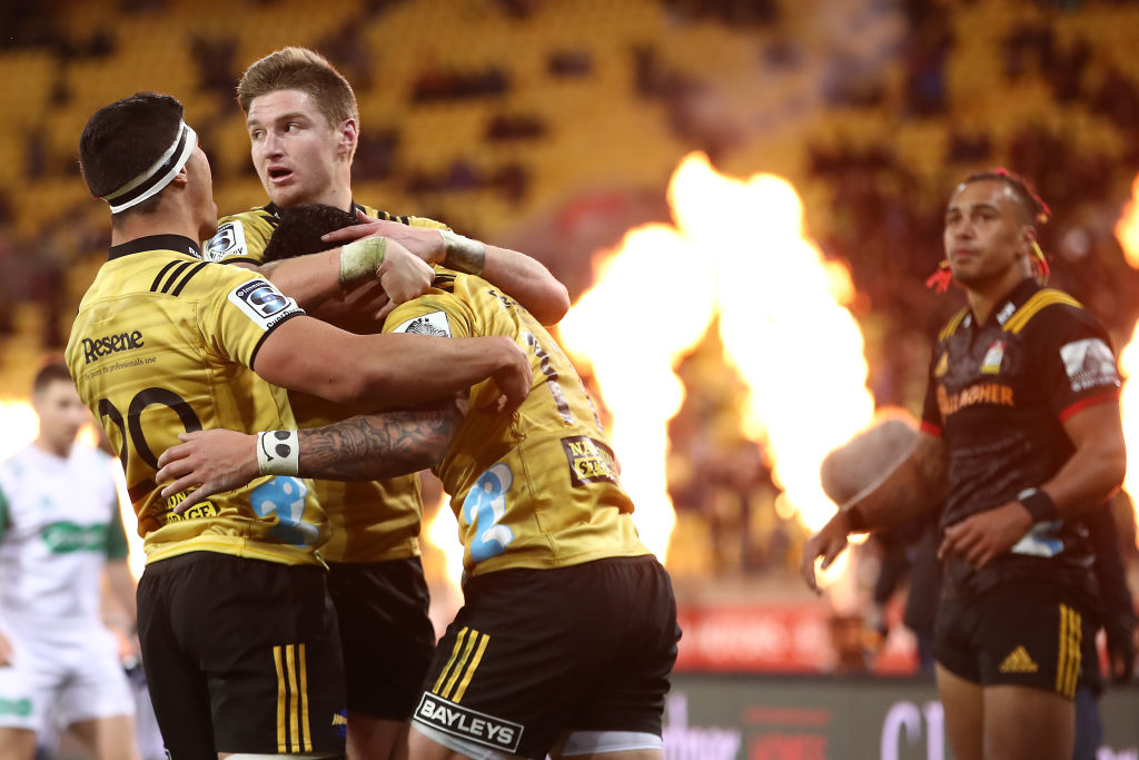 Ben Lam of the Hurricanes scores a try and is congratulated by Jordie Barrett during the Super...
