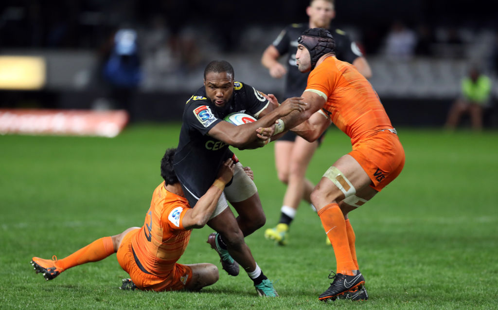 The Sharks' Lukhanyo Am is caught by the Jaguares defence. Photo: Getty