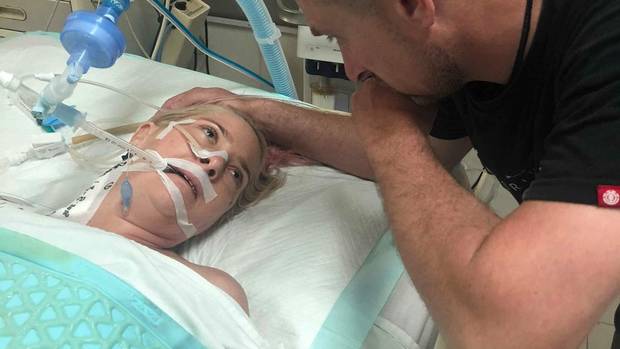 Abby Hartley in hospital in Bali with husband Richard at her side. Photo: NZME/supplied
