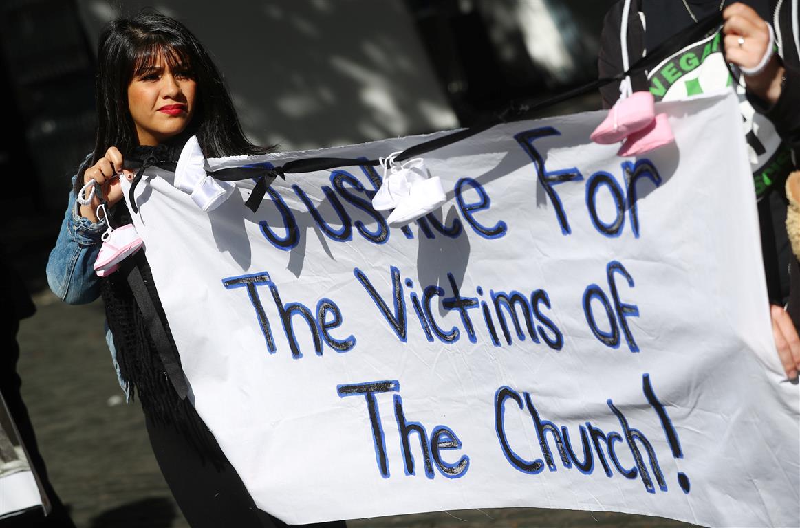 Protesters in Dublin hold banners during a demonstration against clerical sex abuse.Photo: Reuters