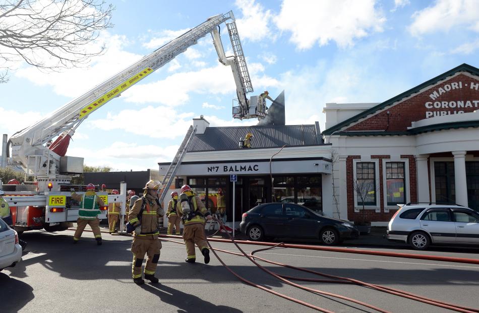 Firefighters rip open the roof of popular Dunedin restaurant No7 Balmac to battle a blaze which...