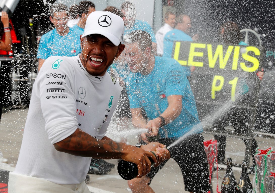 Lewis Hamilton celebrates in the pit lane after his victory in the Italian Grand Prix. Photo:...