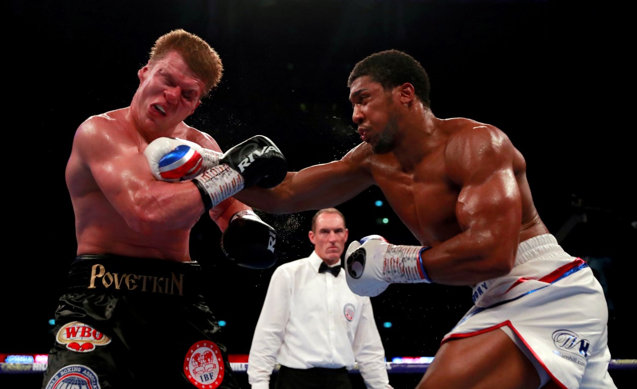 Anthony Joshua lands a right on Alexander Povetkin. Photo: Reuters
