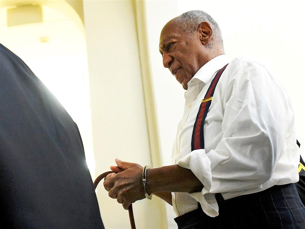 Bill Cosby departs the Montgomery County Courthouse in handcuffs after being sentenced in his...
