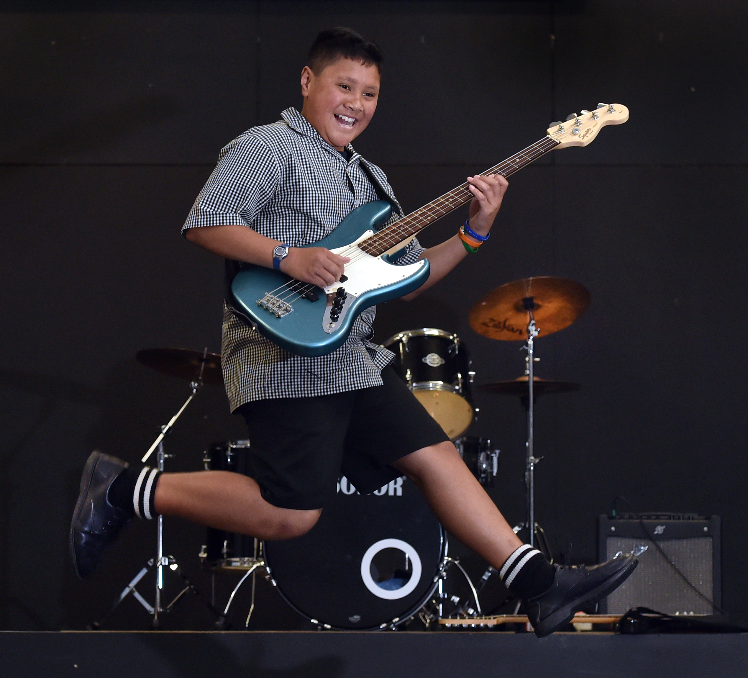Bathgate Park School pupil Harmony Oto struts his stuff on stage after winning the best bassist...