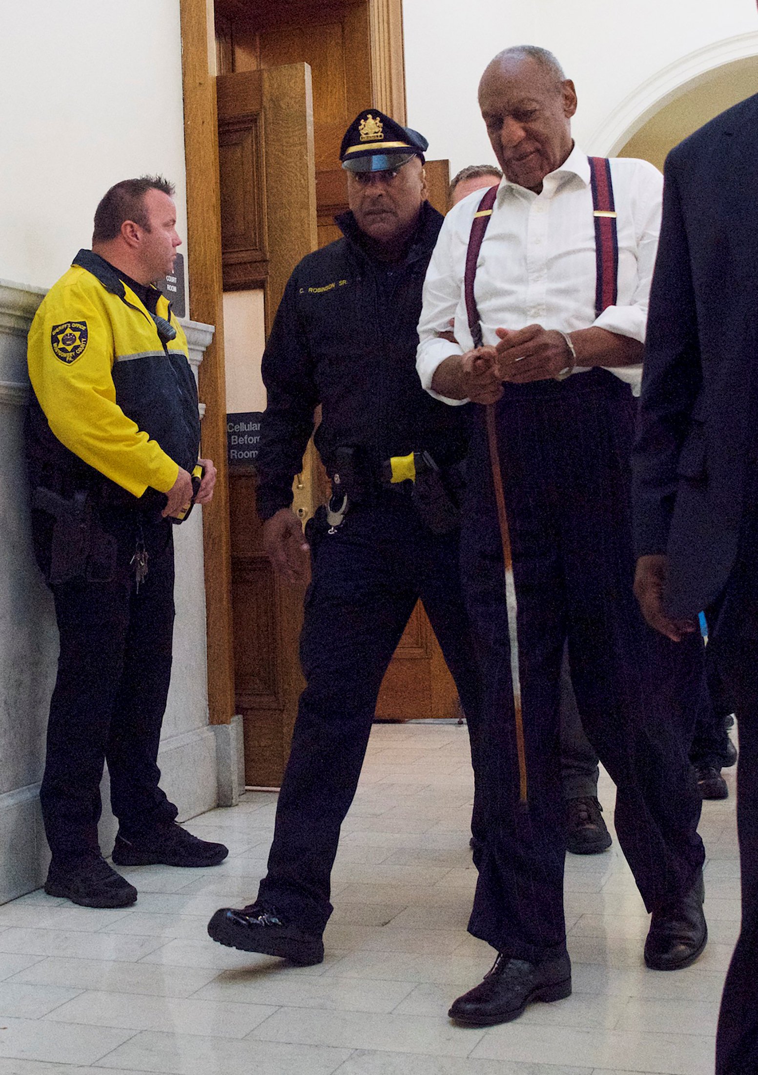 Bill Cosby departs the Montgomery County Courthouse in handcuffs after being sentenced in his...