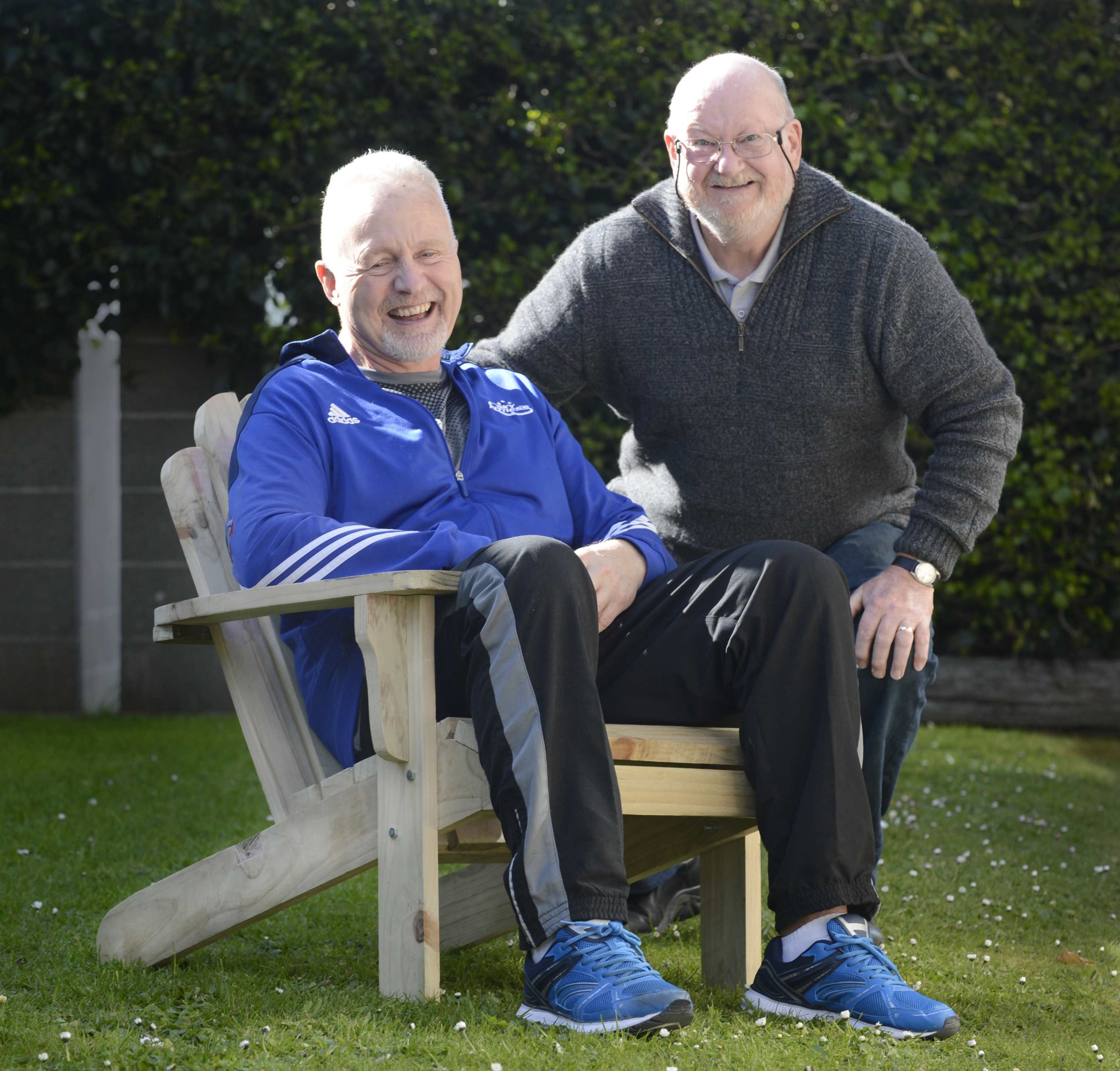 Dave Griffin (59) and Roy Robertson (70) with the chair they built together following Mr Griffin...