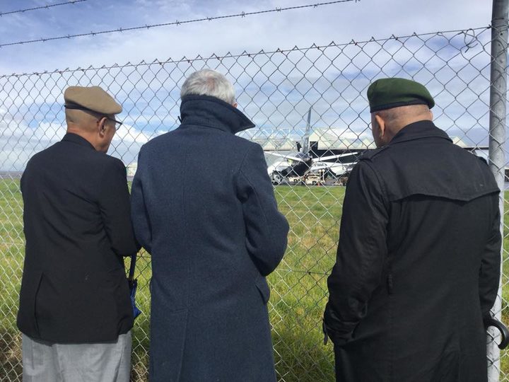 The Vietnam war veterans were only able to view the ceremony from some distance behind a wire...