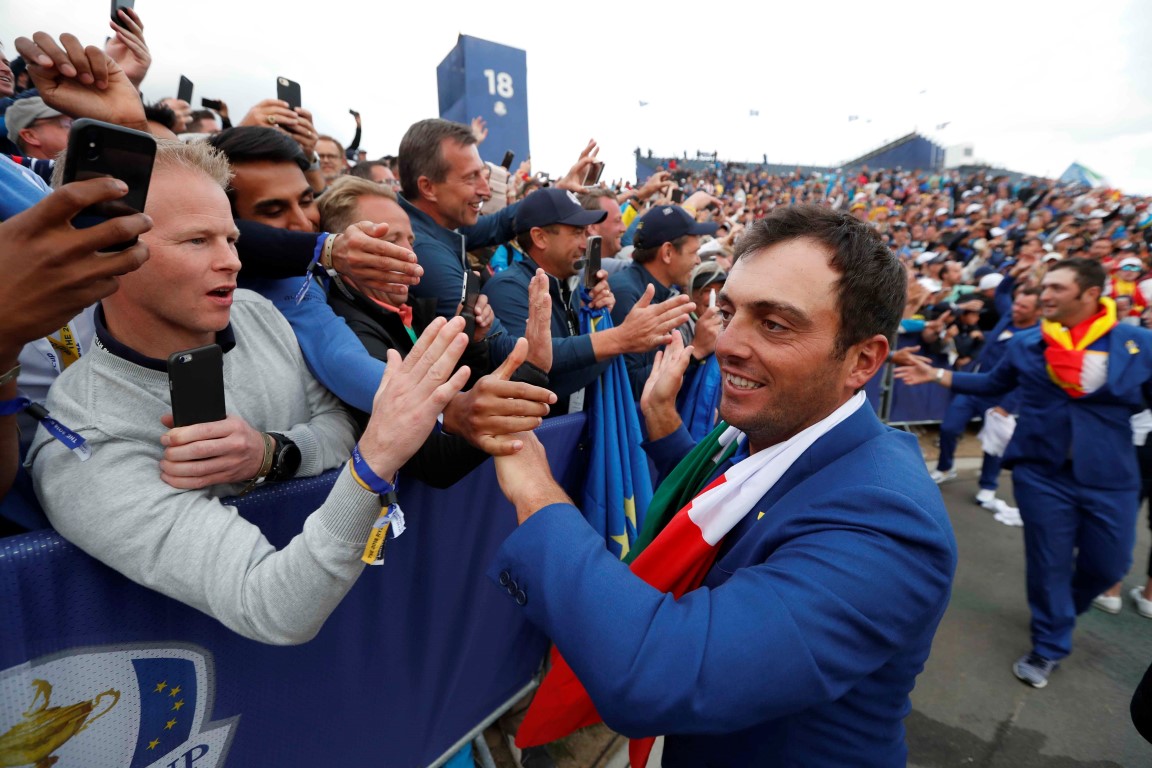Team Europe's Francesco Molinari celebrates with fans after the tournament. Photo: Reuters