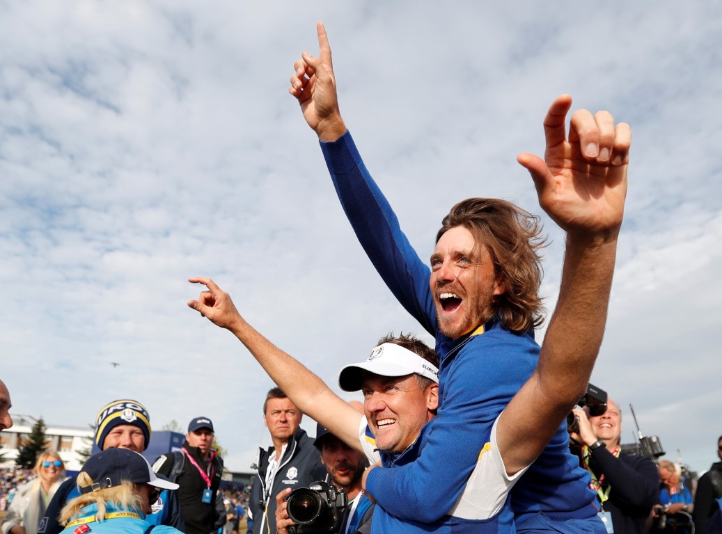 Europe players Ian Poulter (L) and Tommy Fleetwood celebrate their victory. Photo: Reuters