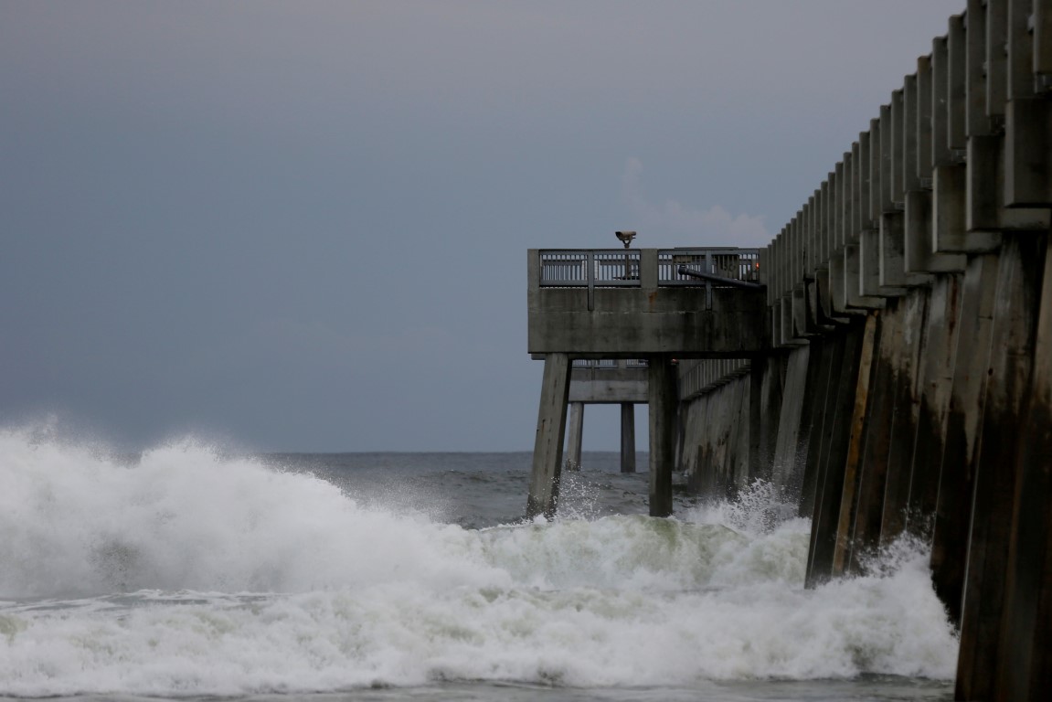 Waves crash along a pier as Hurricane Michael approaches Panama City Beach in Florida. Photo:...