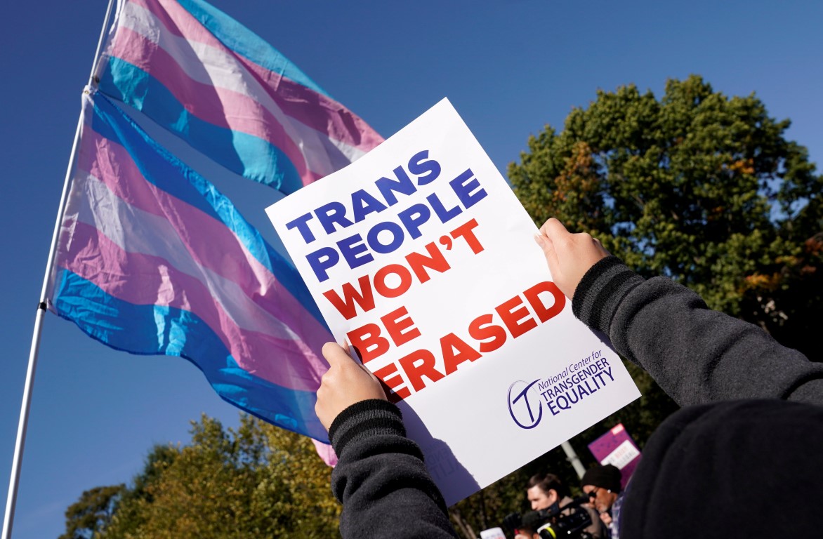 Activists protest the US government's alleged attempt to strip transgender people of official...