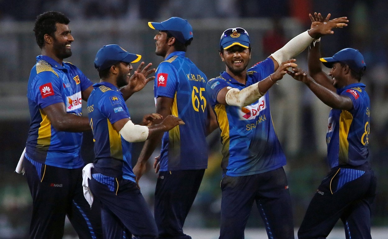 Sri Lankan players celebrate the dismissal of England's Sam Curran. Photo: Reuters