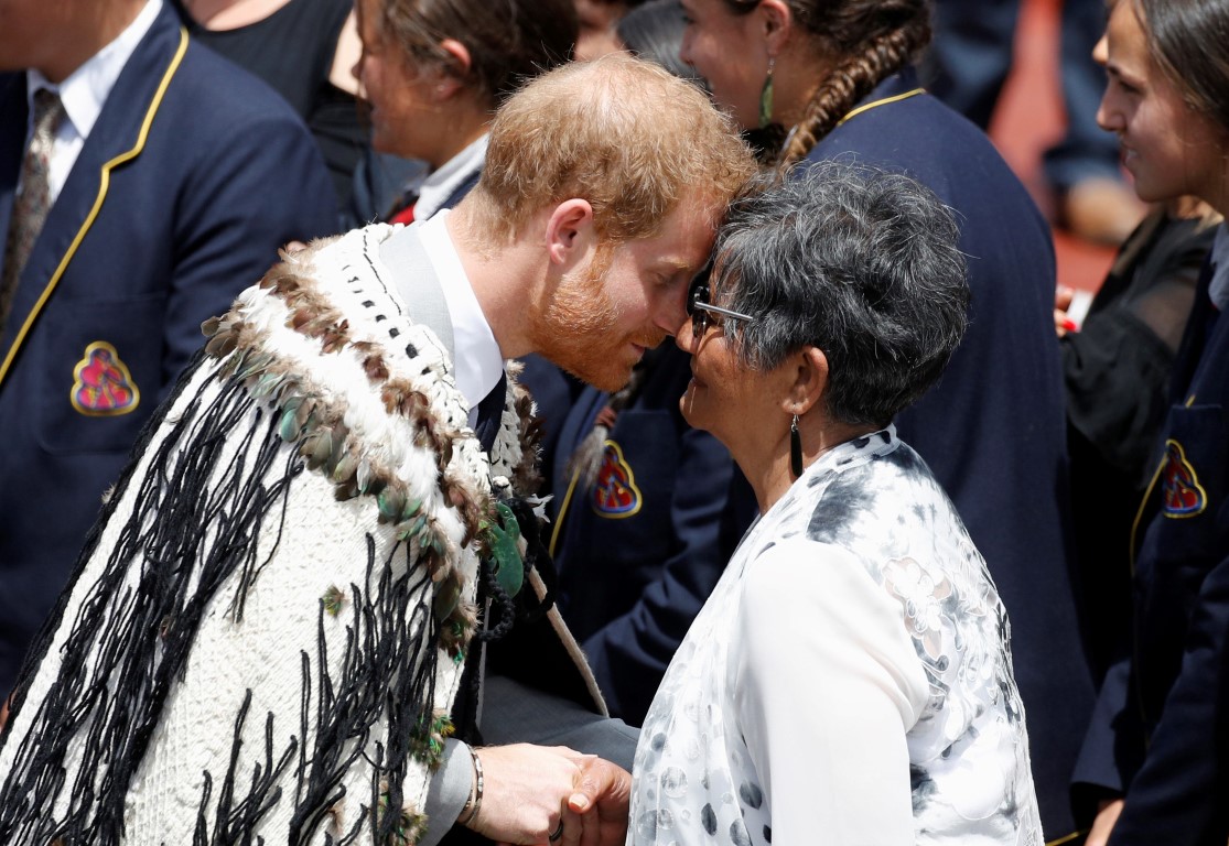 Prince Harry receives a traditional hongi at a formal powhiri after arriving in Rotorua, today....