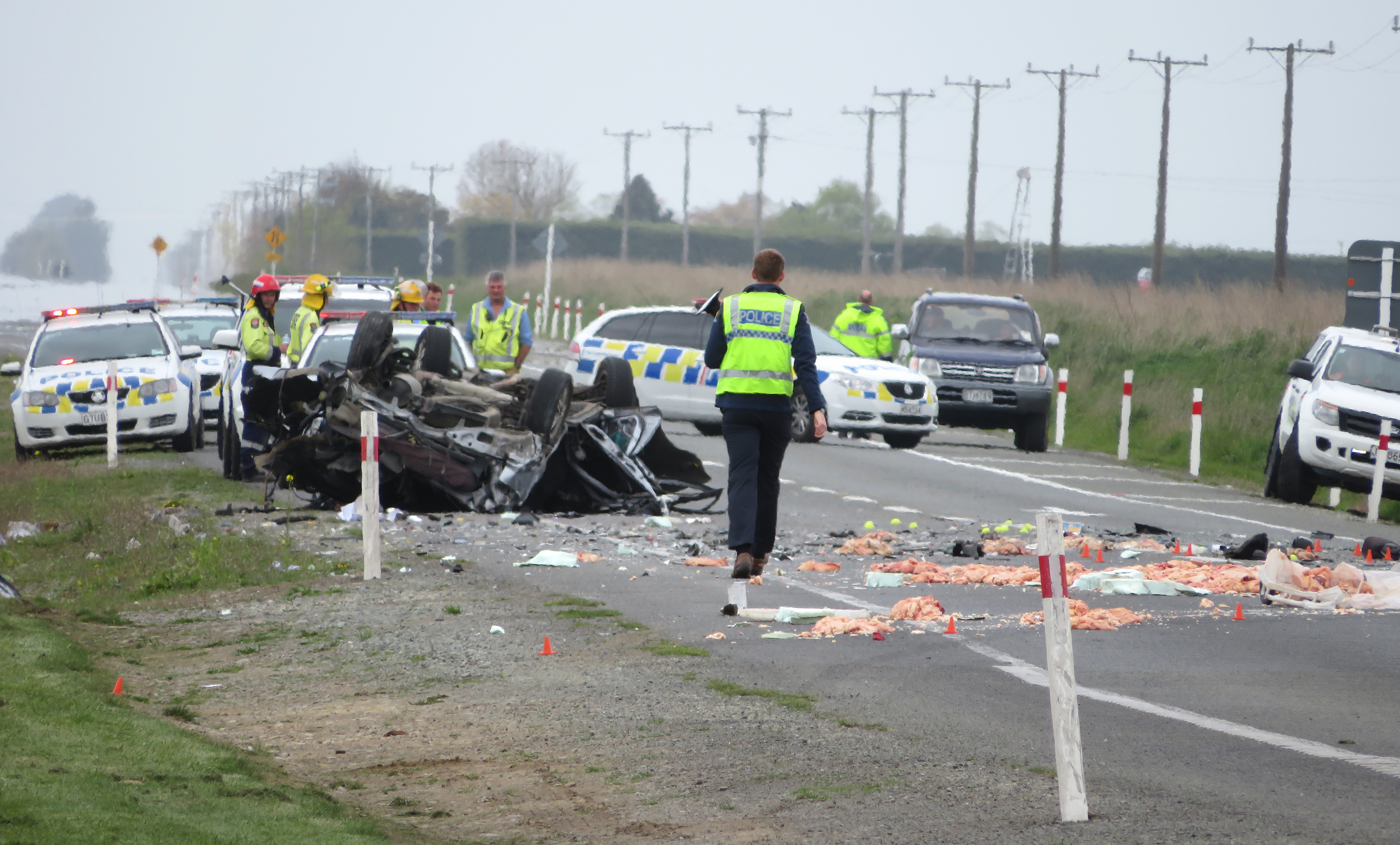 Police at the scene of a crash near Ashburton which killed two people this afternoon. Photo:...