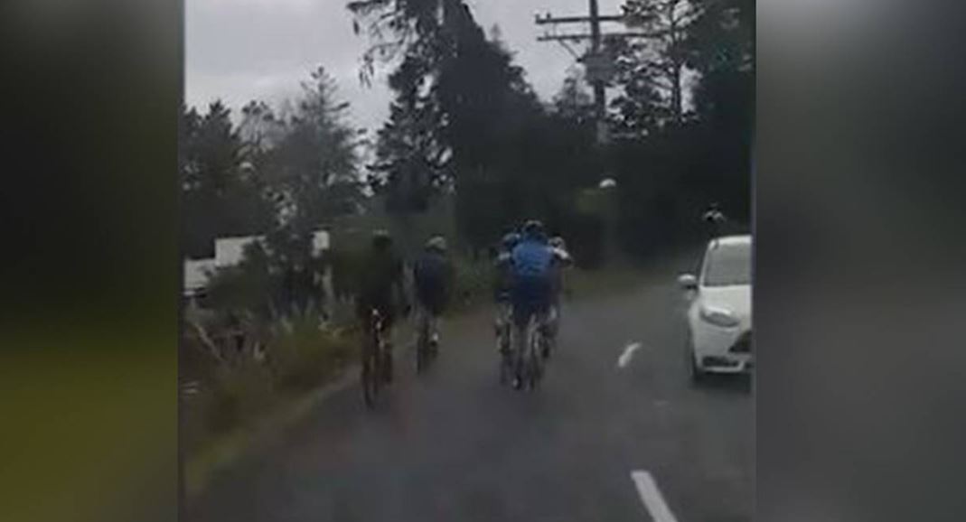 A cyclist had to suddenly swerve back onto his side of the road after crossing the centre line...