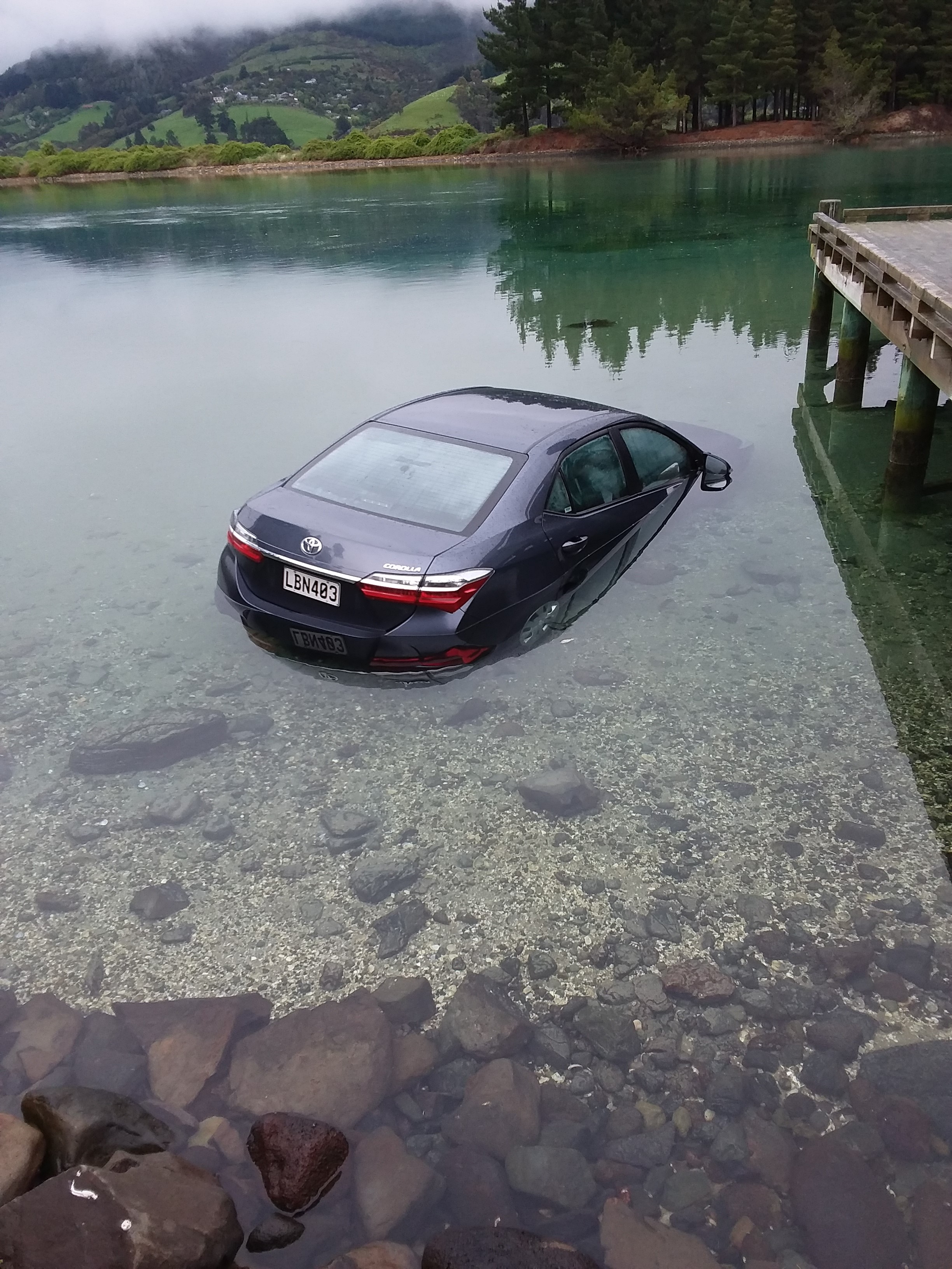 A rental car had to be abandoned after it was driven into the Purakaunui inlet during low tide...
