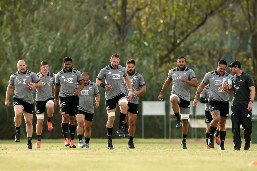 All Blacks squad members warm up before a training session in Rome this week. Photo: Getty