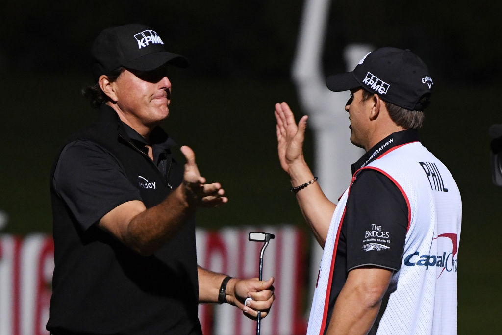 Phil Mickelson (L) celebrates his victory with with caddie and brother Tim. Photo: Getty