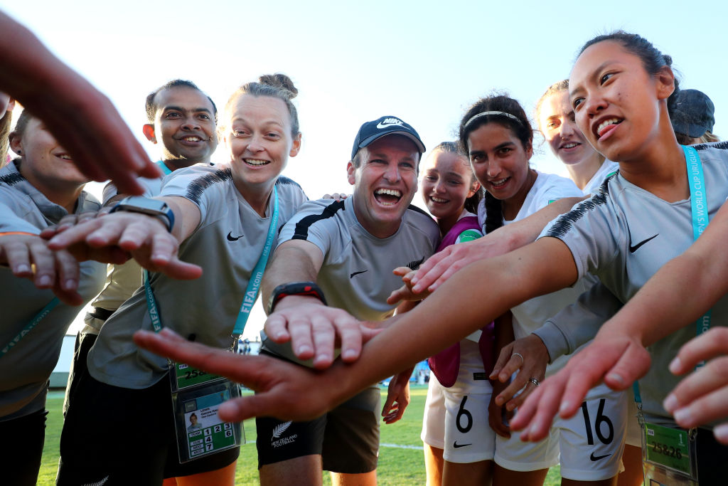 Coach Leon Birnie celebrates with the team after their win over Japan. Photo: Getty