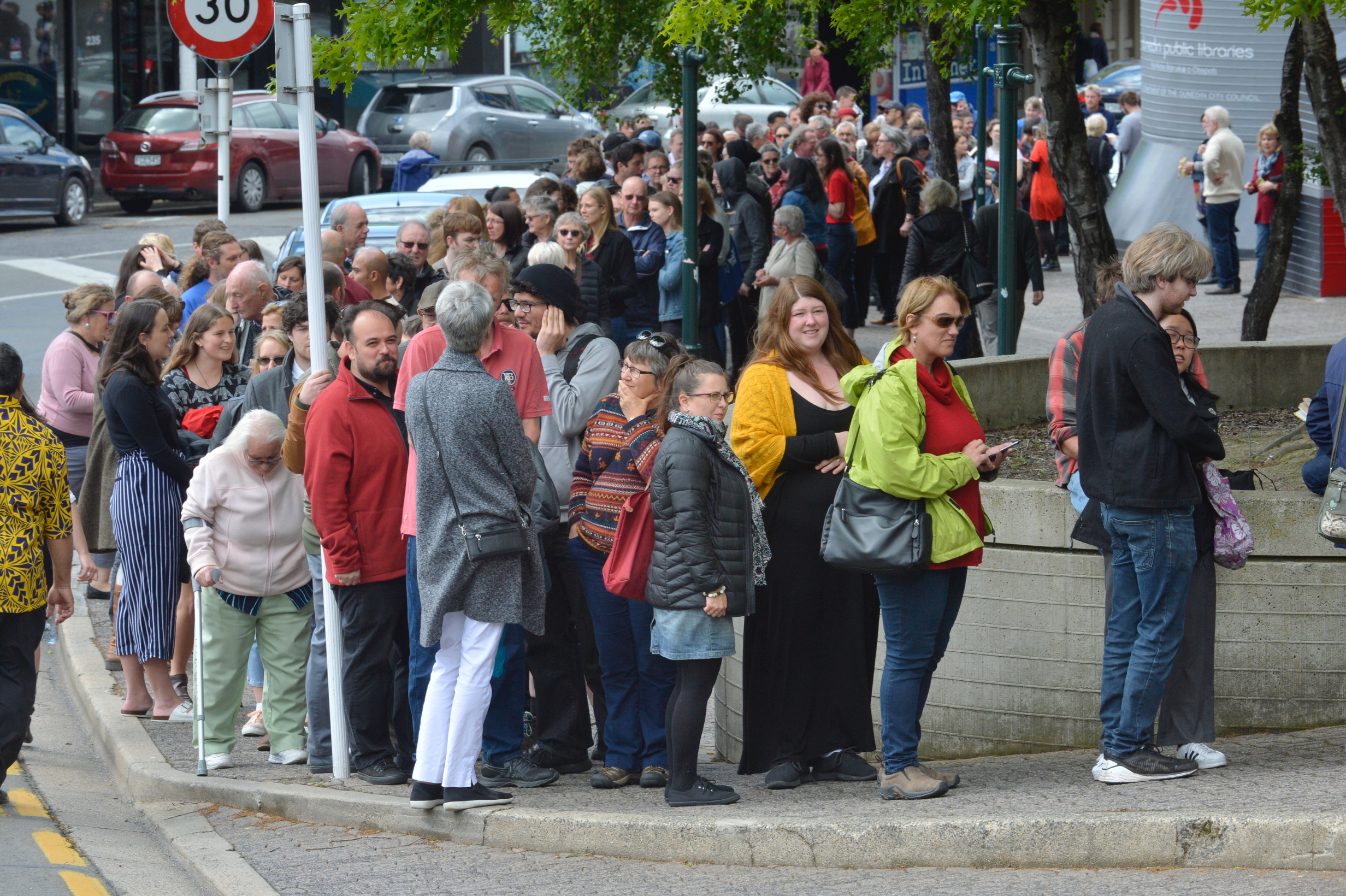 People queue in Moray Place as they wait to get into the Dunedin Town Hall to hear Prime Minister...