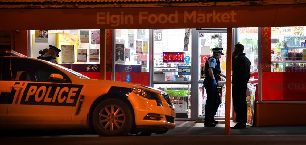 Police at the Elgin Food Market after the robbery in July. Photo: Stephen Jaquiery