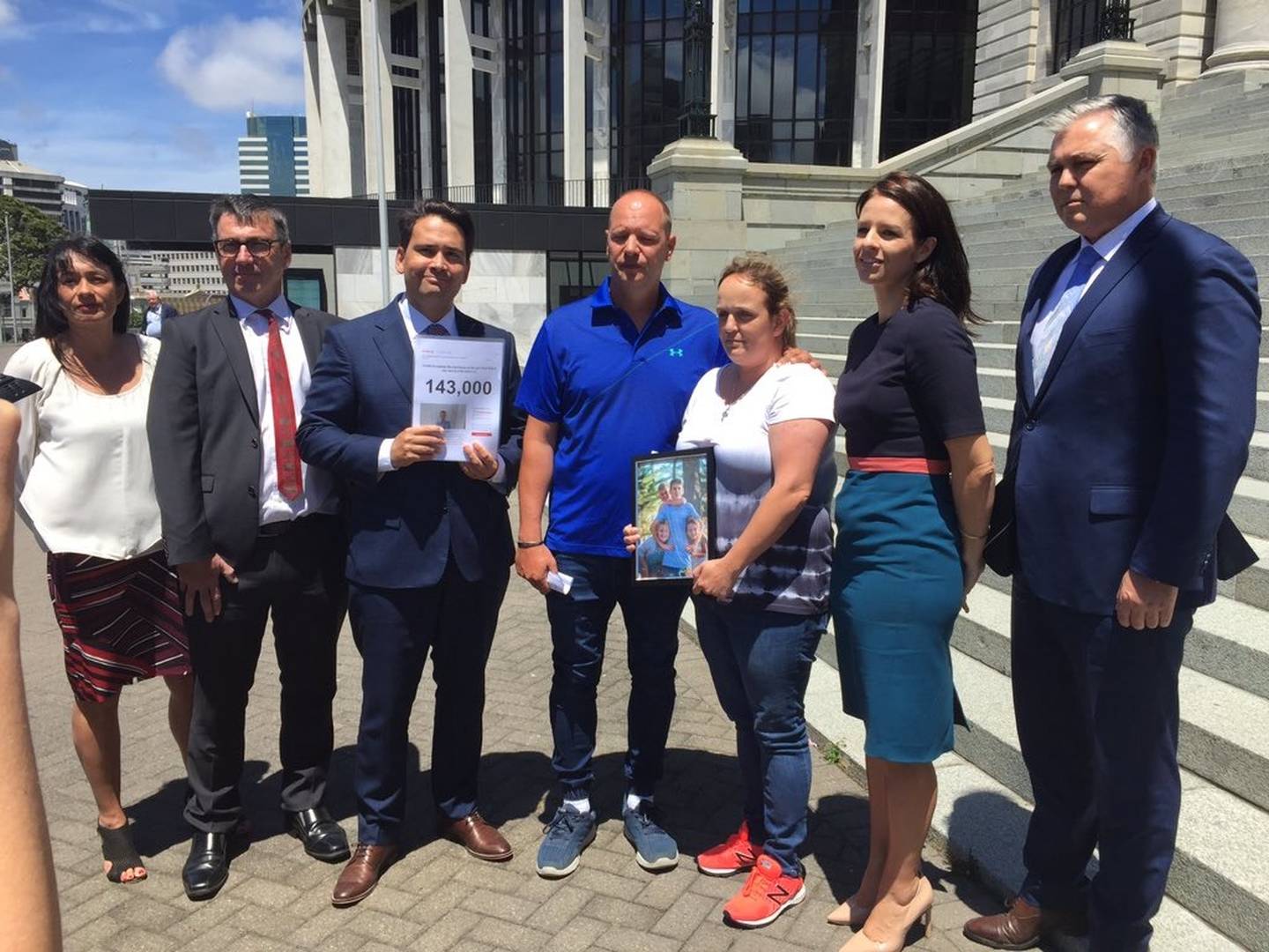 Accepting the petition today are (from left) Labour's Marja Lubeck and Duncan Webb with...