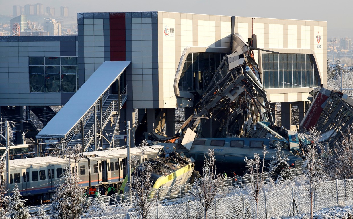 Rescue workers search the wreckage after the crash. Photo: Reuters