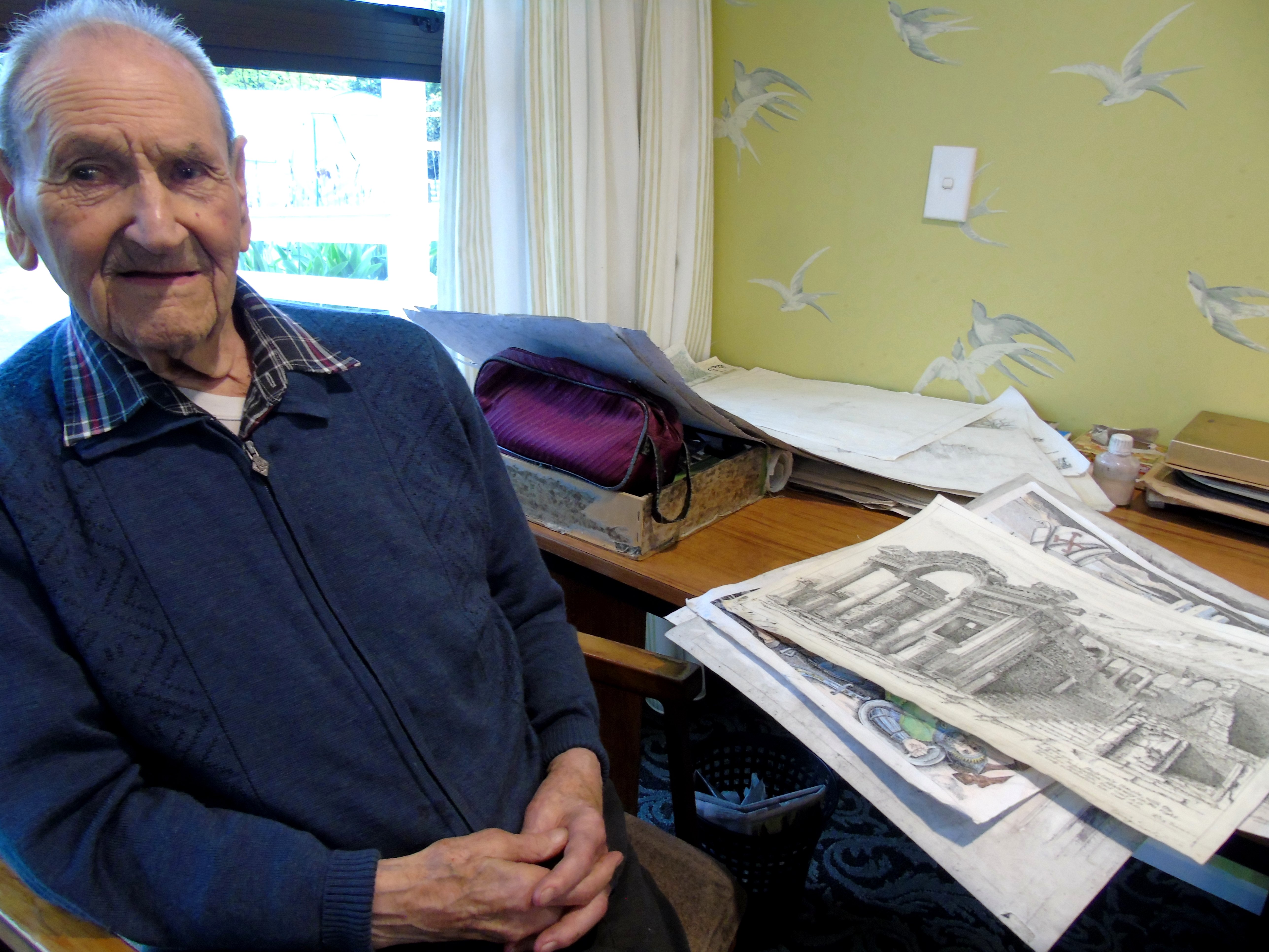 Working on his drawings is Reg Deason, of Wanaka, who celebrated his centenary at Elmslie House...