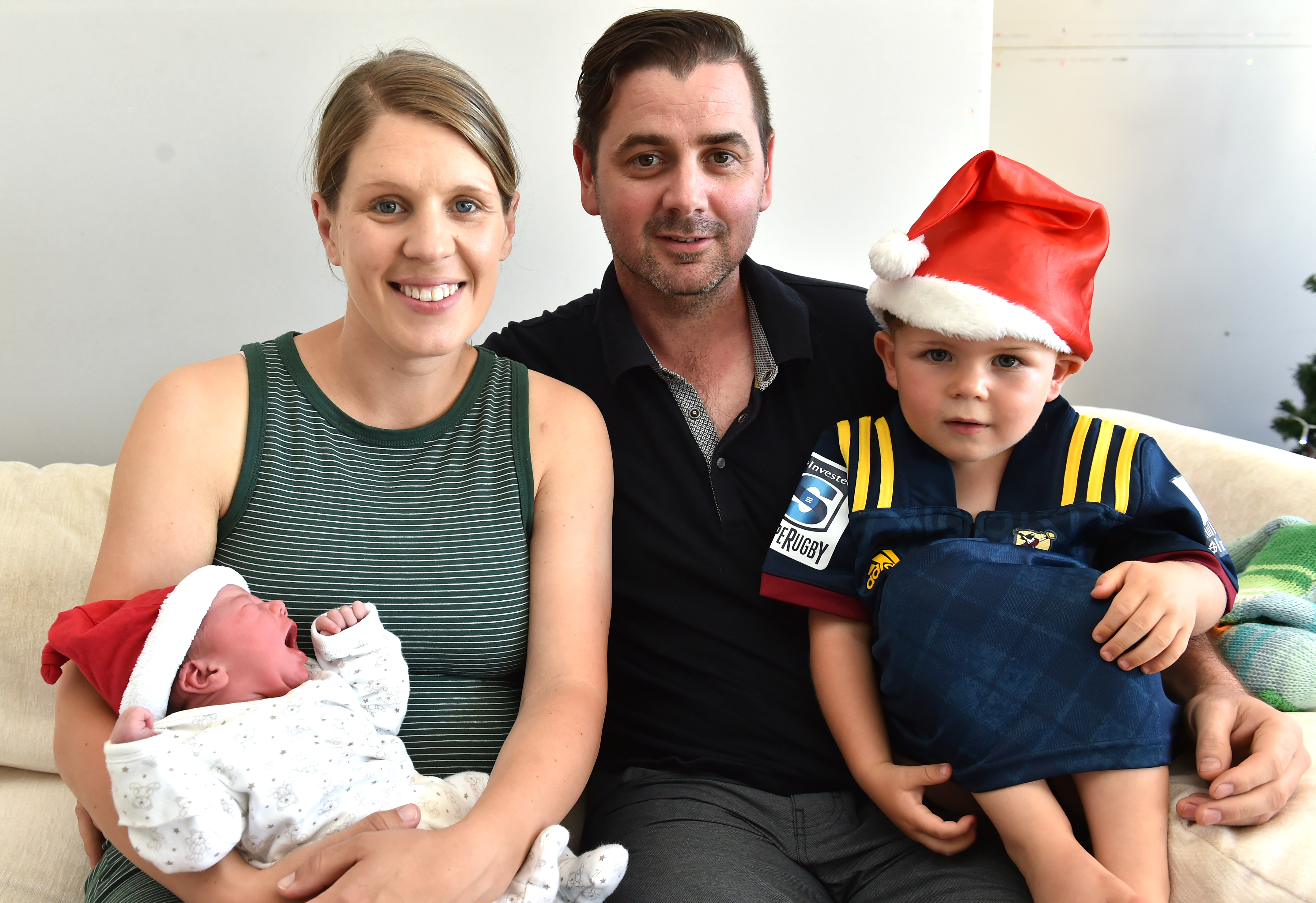 Holding her Christmas baby, Pippa Grace Coppins, is Dunedin mum Mallory Anderson, with her son...